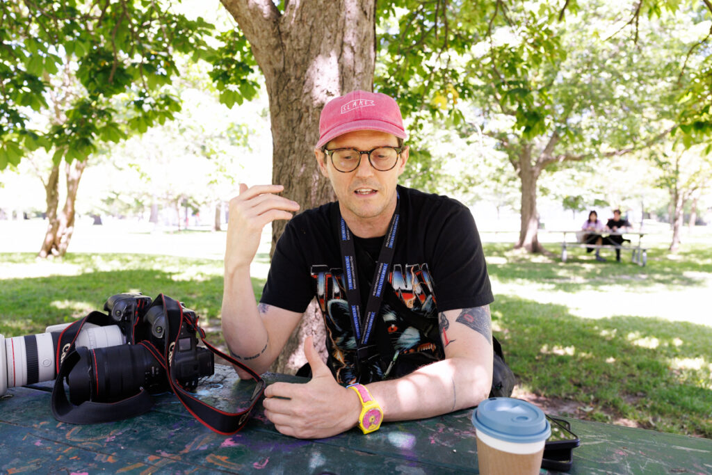 Toronto Star staff-photographer, and photojournalist Nick Lachance boing interviewed in Trinity Bellwoods Park in Toronto.