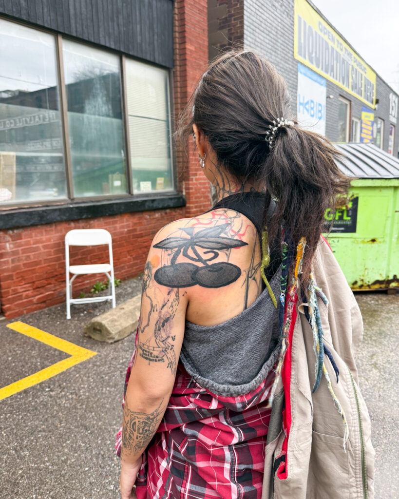 A large shoulder tattoo of cherry's by Douglas Tynes, aka Brotel6.
