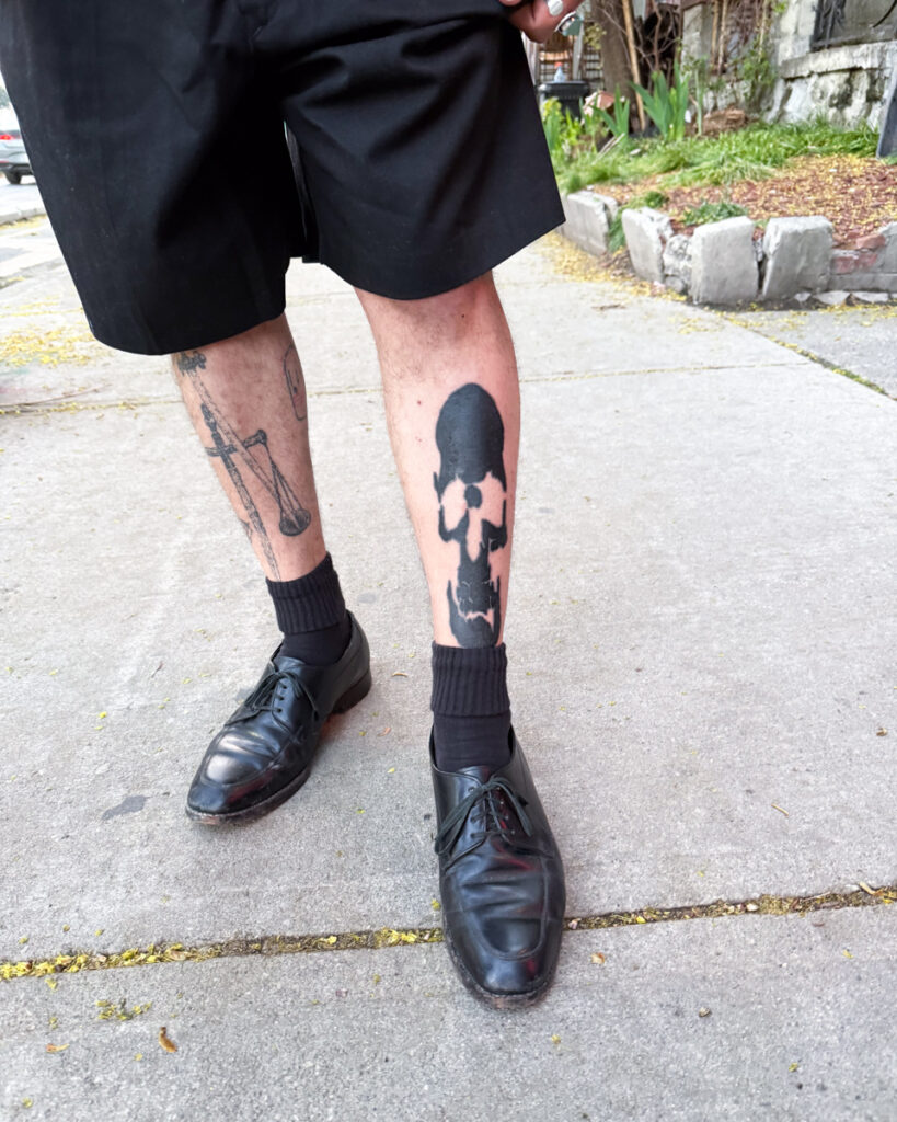 A shin tattoo of a scull by Douglas Tynes, aka Brotel6.