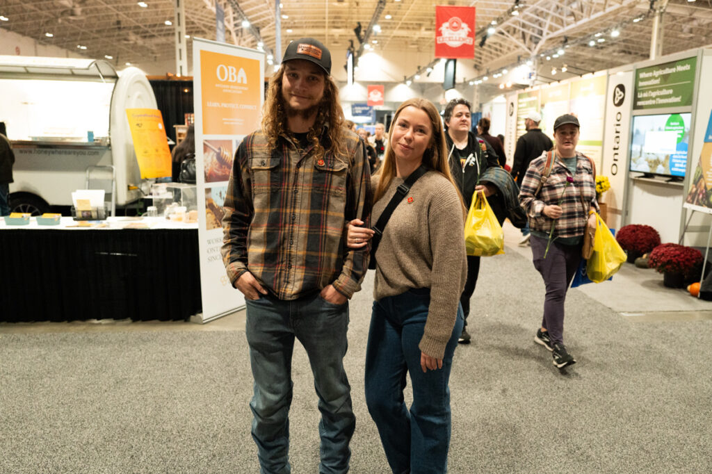 A cute couple from the country posing for a portrait at The Royal Agricultural Winter Fair in Toronto.