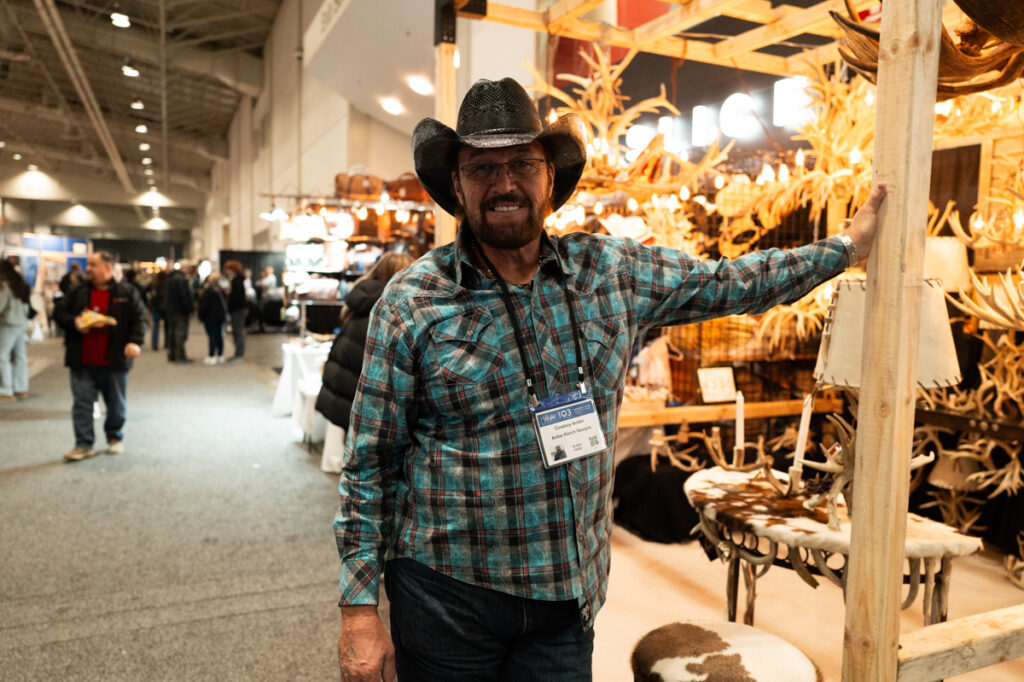 The artist who makes and sells chandeliers made from antlers at The Royal Agricultural Winter Fair in Toronto.